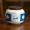 Marco de fotos de fábrica Lata de té de panda Tarro de té de cerámica Tarro de almacenamiento de granos sellado pequeño portátil para el hogar A prueba de luz y humedad