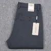Marca de alta gama antiarrugas para hombre, primavera y otoño, ropa formal de negocios, pantalones de hombre, pantalones rectos elásticos, otoño e invierno, pantalones casuales de grosor medio, moda