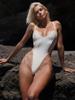 Traje de baño sexy de una pieza de color sólido para mujer, bikini europeo y americano con costuras, traje de baño de comercio exterior para mujer al por mayor de primavera y verano
