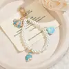 Colgante Llavero de Concha de Perla para Mujer Moda Cadena para Teléfono Accesorios de Bolso Sentido del Diseño Adornos Pequeño Regalo Al Por Mayor