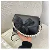 Bolso Pequeño de Cadena de Perlas para Mujer 2025 Nuevo de Moda Casual Texturizado con Lazo Bolso de Hombro Cruzado