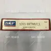 Suministro en stock de rodamiento de bolas de rodillos doble autoalineable 1207EKTN9