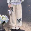 Conjunto casual y elegante de chica con personalidad, top de retazos a rayas con cuello de polo, estilo dos piezas falsas, pantalones casuales retro de mariposa, moderno