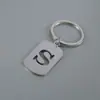 Venta Caliente de Productos Nuevos Transfronterizos 26 Letras Inglesas Huecas de Acero de Titanio Sin Decoloración Accesorios de Joyería Llavero 26 Letras