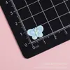 Pajarita Colorida Mini Tamaño Pequeño Clip para Uñas Imán para Nevera Pegamento en Crema Accesorios DIY Parches para Ropa Mayoreo