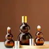 Botella cuentagotas de goma con cabeza de bulbo doble color té, botella para aceite esencial, botella cosmética, botella vacía para dividir esencia o emulsión, venta al por mayor
