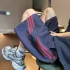 Shorts Casuais Listrados Largos Masculinos e Femininos da High Street Americana Moda Tendência de Verão Shorts Esportivos de Basquete