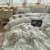 Funda de edredón con borde de algodón lavado suave y agradable para la piel Juego de cama de cuatro piezas Sábana de cama agradable para la piel Funda de edredón Juego de tres piezas para estudiante 4
