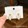 Pendientes Populares Multiestilo Aguja de Plata 925 Nicho Exquisitos Pendientes de Moda Pendientes de Corazón Mariposa Perla Venta al por Mayor