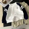 Camiseta de Manga Larga para Niños Primavera y Otoño 2026 Nuevo Estilo Top Versátil Infantil con Mangas Ranglán, Camiseta Base Infantil de Dibujos Animados de Moda para Niñas
