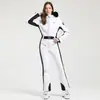 Nuevo traje de esquí de una pieza profesional para mujer para esquí al aire libre con doble tabla, a prueba de viento, cálido, impermeable, ajustado, alta elasticidad, traje de esquí transfronterizo para mujer