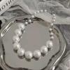Collar de perlas degradadas para mujer, elegante, de alta gama, ligero, de lujo, cadena de clavícula, nuevo estilo, cadena de cuello de estilo frío simple.