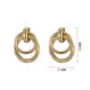 Pendientes al por mayor con personalidad de moda retro transfronteriza de Europa y Estados Unidos, pendientes huecos de círculo multicapa exagerados con red roja.