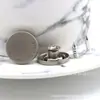 Fabricante 17MM aleación cabeza oscilante correa de botón de mezclilla hebilla de pantalón de mezclilla hebilla redonda hebilla metálica en forma de I