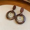 Pendientes de borla con carcasa de madera marrón transfronterizos europeos y americanos, pendientes de estilo vintage Maillard, pendientes de mujer de lujo ligero de alta gama