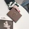Cartera de Cuero Genuino para Mujer Porta Tarjetas Ultraligera con Cierre Estilo Corto Elegante Combinación Diaria Versátil Nuevo Producto Caliente Transfronterizo 2025