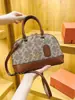 Bolso de Hombro Vintage Nueva Moda Otoño/Invierno 2026 para Mujer con Monograma Bolso Versátil Estilo Europeo y Americano Forma de Concha Personalidad Única
