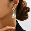 Brincos de casamento de noiva exagerados Brincos longos populares africanos para mulheres com incrustação de diamantes Brincos de franja de prata europeus e americanos transfronteiriços