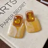 Pendientes de borla con carcasa de madera marrón transfronterizos europeos y americanos, pendientes de estilo vintage Maillard, pendientes de mujer de lujo ligero de alta gama