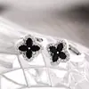 Bestseller transfronterizo: Exquisitos pendientes de botón de circón de trébol con diseño único, de lujo ligero y estilo elegante para mujer