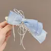 Pinza Plátano Plisada Vertical con Lazo Floral para Cola de Caballo de Verano 2026 Nuevos Pasadores para la Parte Posterior de la Cabeza Accesorios para el Cabello