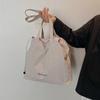 Bolso de lona sencillo e informal para mujer, bolso de mano de estilo coreano de gran capacidad, bolso de hombro moderno y a la moda para primavera y verano 2025.