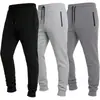 2026 Marca Independiente Estilo Europeo y Americano Color Sólido Versátil Bolsillo Diseño de Cremallera Cordón Pantalones Largos Deportivos para Hombre Venta al por Mayor