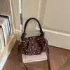 Bolso único de lunares para mujer, nueva moda de verano 2026, bolso de hombro y cruzado de alta gama vintage para el día a día