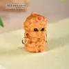 Directo de fábrica tallado de sándalo caricatura lindo estilo nacional texto juego a través del agujero accesorios llavero colgante accesorios venta al por mayor