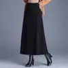 Elegante y minimalista falda midi de lana línea A, nueva colección otoño/invierno 2026, de cintura alta, estiliza y cubre la cadera, adecuada para ropa de trabajo