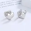 Pendientes de plata de ley s925 con forma de corazón tridimensional diseño de nicho ins estilo europeo y americano de网红 frío geométrico ear cuff joyería