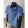 2026 Verano Diseño a Cuadros Marca de Moda Talla Grande Botones Holgada Camisa de Manga Corta para Hombre Cd6430 Ropa de Moda para Hombre