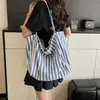 Bolsa bucket listrada color block única para mulheres, nova bolsa de ombro e transversal da moda 2026, bolsa tote fashion para meninas