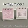 Lindo Calendario de Escritorio Pequeño de Estrellas con Alas de Dibujos Animados 2027 Estilo Ins Alto Valor Decoración Mini Adorno de Escritorio para Estudiantes