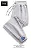 Pantalones casuales para hombre, primavera y otoño, nuevos pantalones deportivos de nueve dedos, holgados y a la moda para jóvenes, pantalones deportivos para hombres jóvenes.