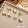 Acessórios de Nail Art Tridimensionais de Luxo Leve Borboleta Esmaltada Mini Laço de Liga Metálica Recorte Vazado Decoração de Unha Atacado