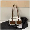 Moda transfronteriza diseño de doble bolsillo bolsa de boliche para mujer nuevo tacto de alta gama bolsa de almohada de una sola pieza bolsa de axila retro moderna