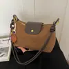 Bolso de gamuza para mujer, nuevo modelo de otoño 2026, bolso de hombro bajo de nicho vintage de alta gama, bolso cruzado para el día a día