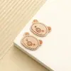 Nueva etiqueta de cuero con cabeza de oso linda cosida a mano sombrero bufanda adorno para la cabeza marca de cuero accesorios de ropa al por mayor