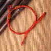 Cuerda de mano semiacabada tejida a mano botones de colores hebilla de piña pulsera de cuerda roja diy joyería de mano para niños al por mayor mano