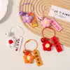 Llavero de flor de pompón de ganchillo, colgante para bolso, accesorio exquisito y práctico para estudiantes, regalo de graduación para profesores