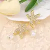 Moda transfronteriza estilo náutico tendencia de diamantes estrella de mar colorida pendiente de imitación de perla pendientes de estilo vacacional en la playa