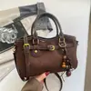 Bolsa colgante de adorno con estampado de leopardo miu de alta gama para mujer, nuevo estilo 2026, bolso de mano retro de un solo hombro, bolso cruzado versátil para el trabajo