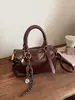 Bolso de mano vintage de alta costura tipo bolsa de almohada para mujer, nuevo bolso de hombro de moda otoño e invierno 2025, bolso cruzado versátil para el día a día