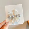 Presilha de Cabelo Infantil Doce e Elegante com Laço e Pérola, Presilha Lateral de Alta Qualidade Estilo Francês, Acessório de Cabelo Tipo Bico de Pato