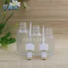 Botella transparente esmerilada para aceites esenciales al por mayor botella cosmética botella con gotero botella de vidrio botella vacía blanco grano fino cabeza de goma blanca