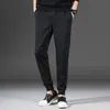 Pantalones Casuales de Otoño e Invierno Negros de Cintura Media con Rayas Tejido Elástico Forro Polar Microelástico Juvenil Sueltos para Hombre