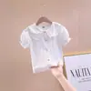 Nuevas Camisas de Manga Corta para Niñas Verano 2026 Estilo Coreano Tops con Cuello de Muñeca Elegantes Camisas Blancas para Niños con Mangas Abullonadas