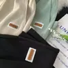 2024 Nuevos pantalones cortos casuales de seda de hielo de secado rápido para hombre, verano, delgados, holgados, con caída, modernos, bordados, rectos