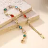 Joyería de moda transfronteriza: Pulsera de acero inoxidable gota de agua con diamantes de colores, chapado en oro de 18k, sensación de lujo ligero de alta gama, accesorio de mano para mujer, en stock